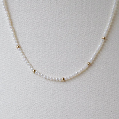 pearl necklace with gold beads