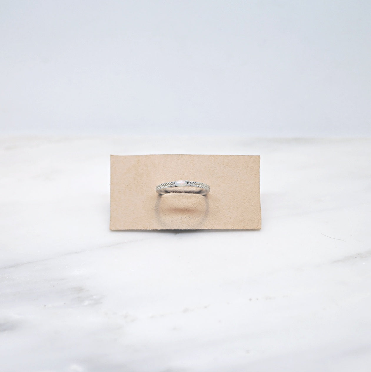 Opal solitaire ring with details