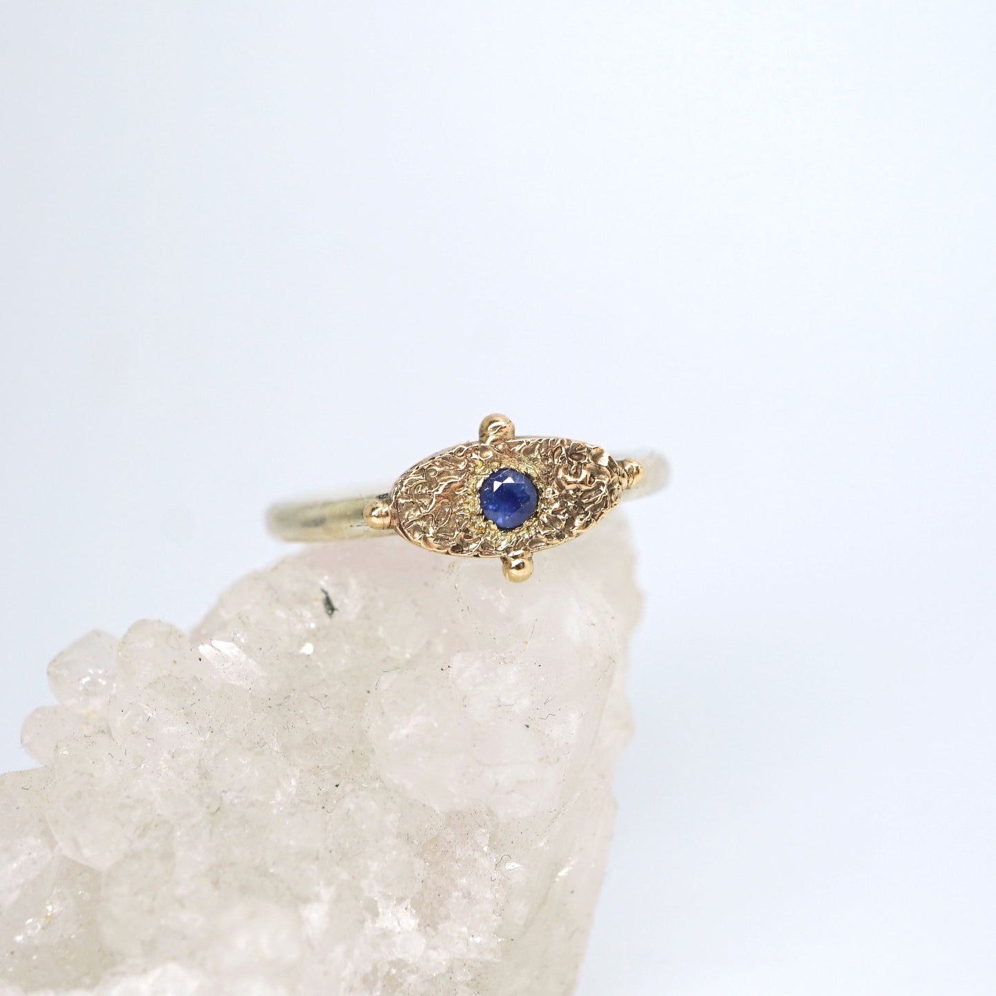 Textured signet ring with blue sapphire