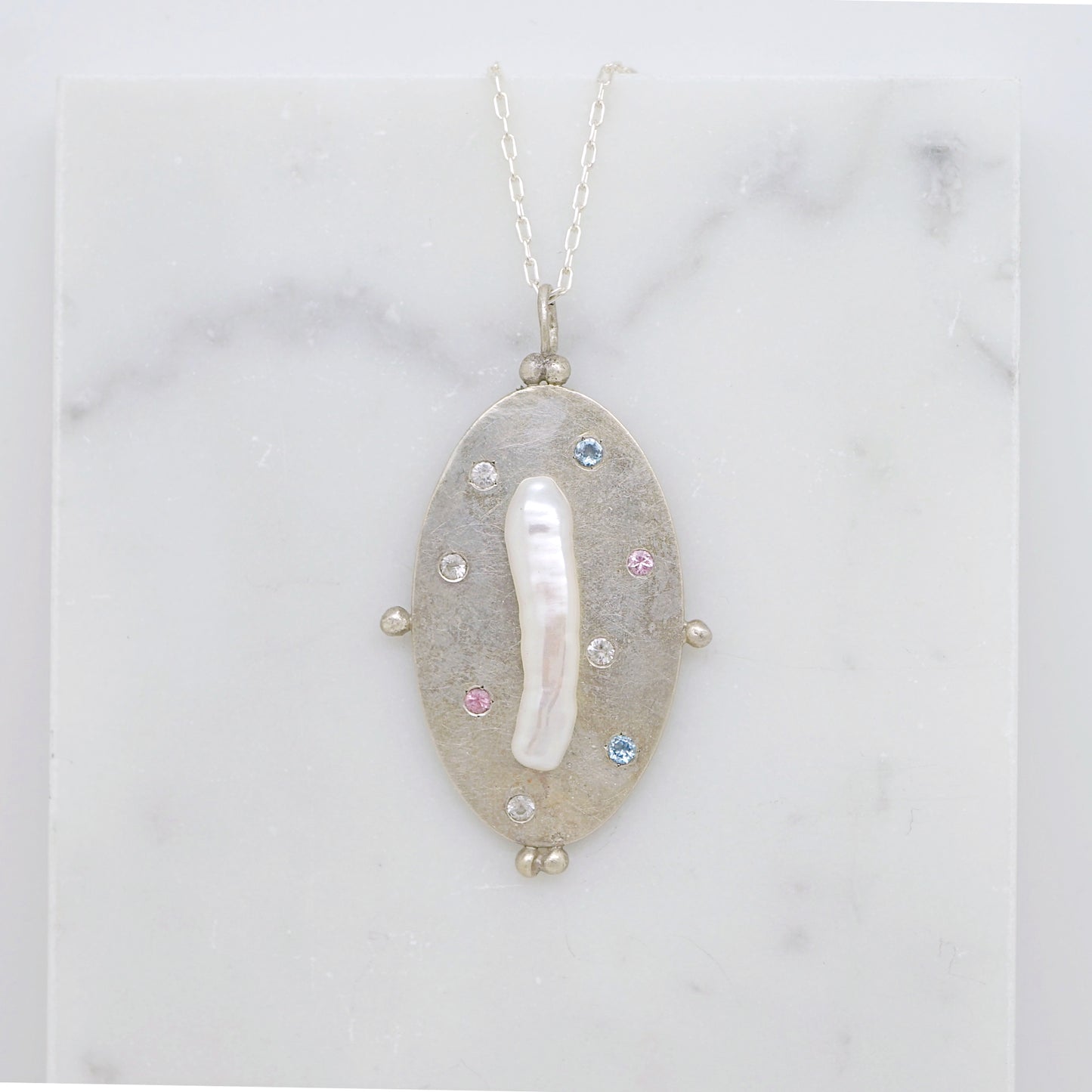 Art pendant necklace with keshi pearl and sapphires