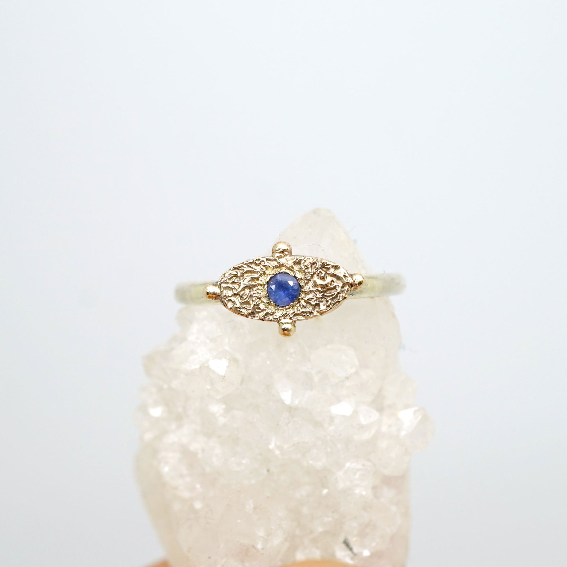 Textured signet ring with blue sapphire