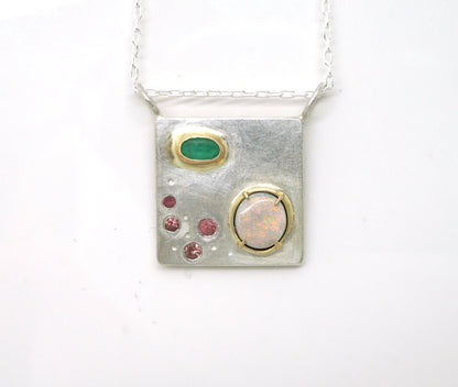 Art pendant necklace with emerald, opal, and tourmaline