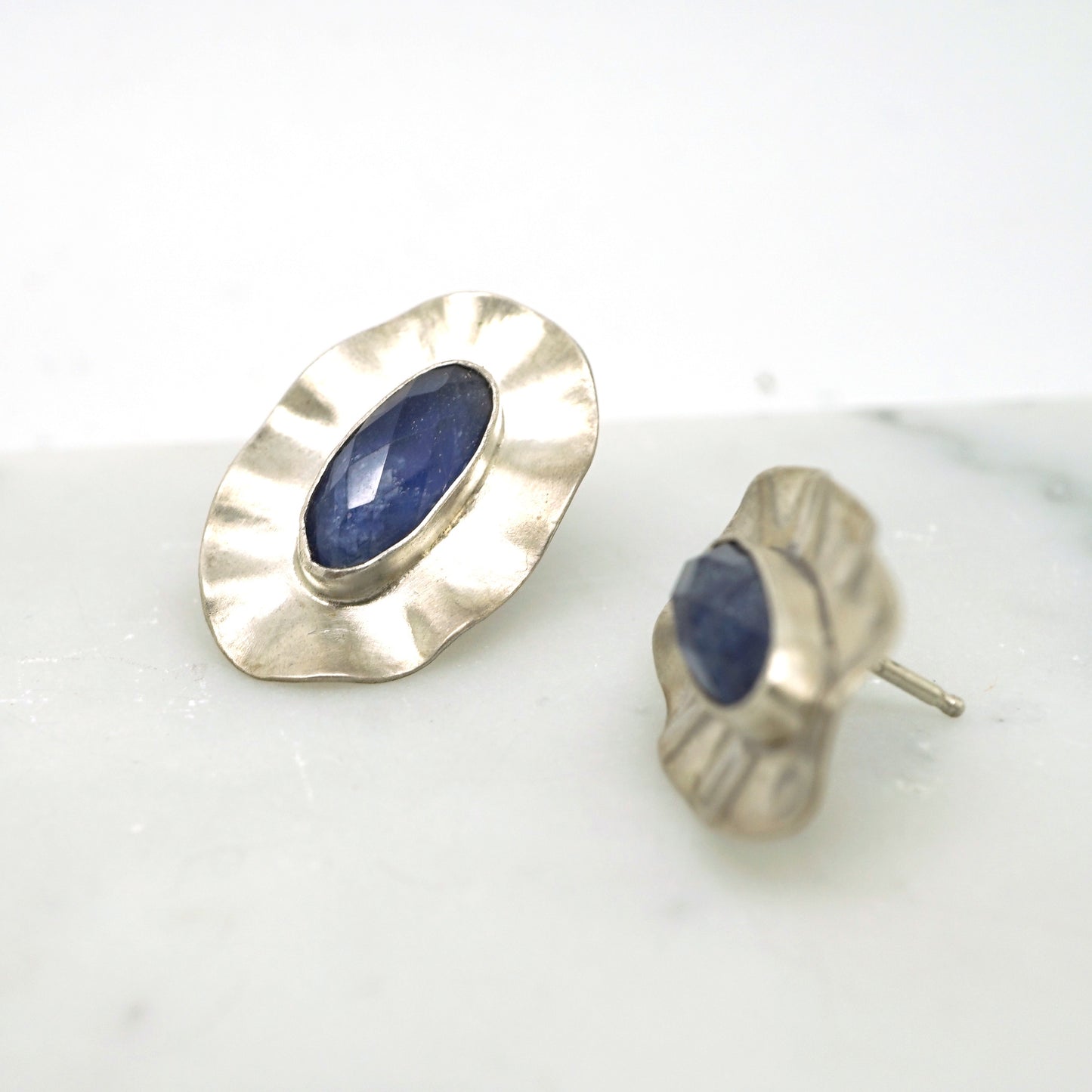 Ruffle stud earrings with blue sapphire
